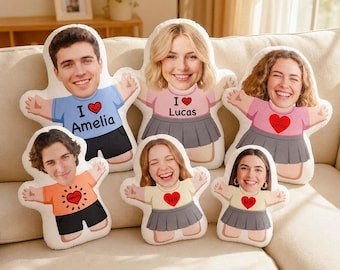 Kids photo pillows on a couch